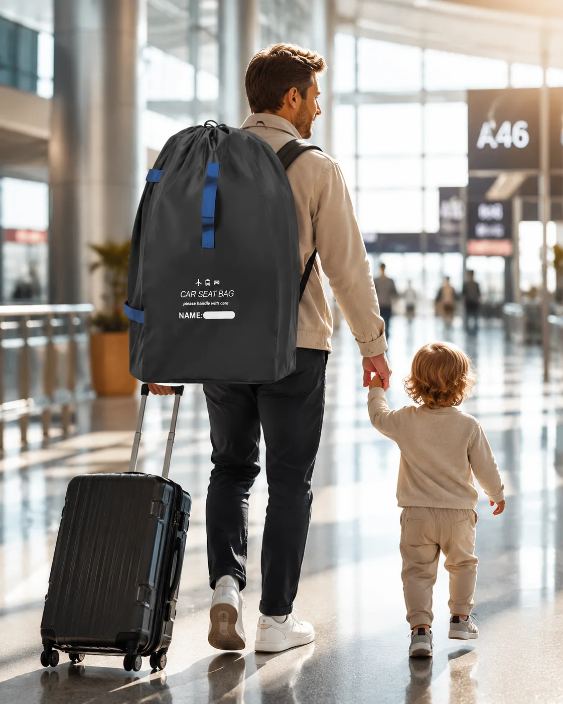 Father wearing the car seat travel bag as a backpack, pulling a suitcase and holding a toddler's hand in the terminal